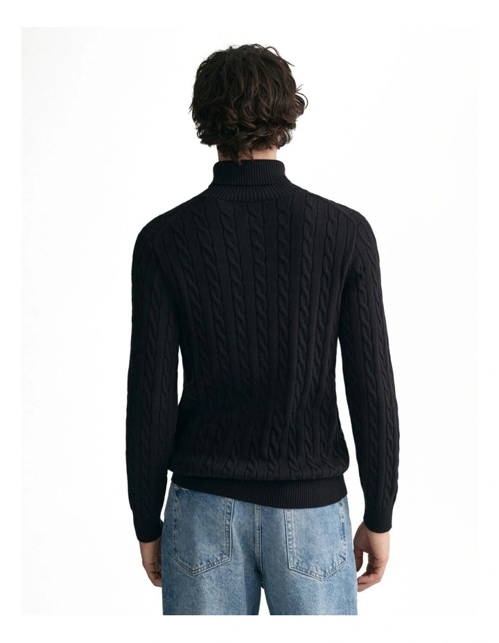 Cotton Cable Knit Turtleneck Sweater in Black
