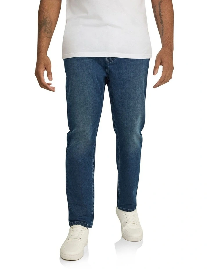 Carl Tapered Knit Denim Jeans in Dark Wash