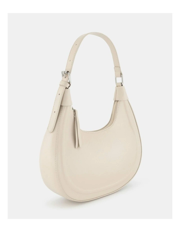 Arvada Curved Crossbody Bag in Cream
