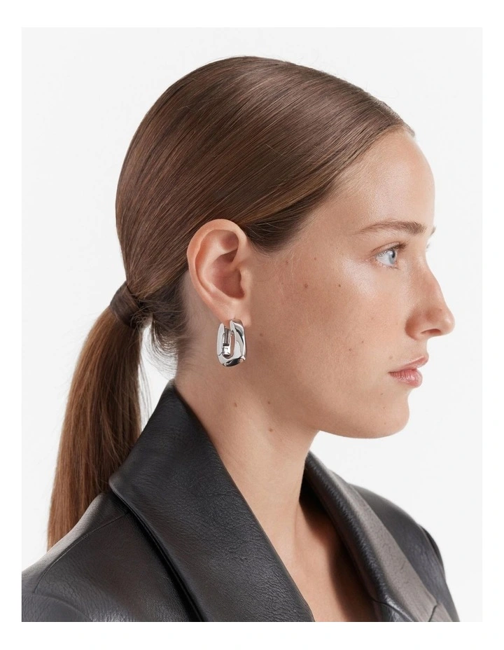 In A Twist Huggie Hoop Earrings in Silver