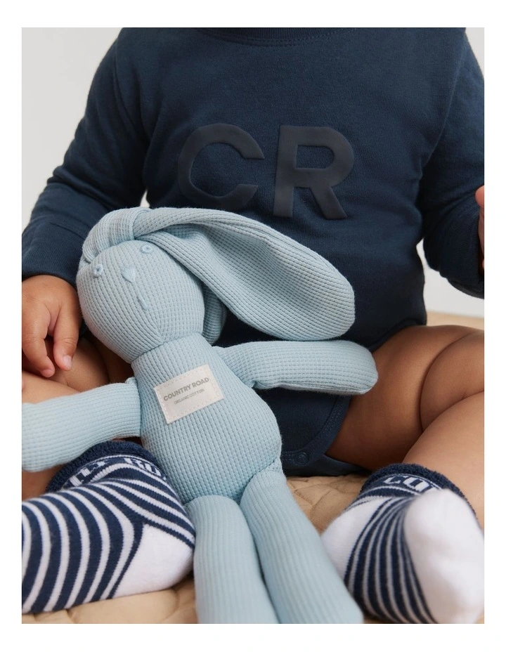 Organically Grown Cotton Puff Logo Long Sleeve Bodysuit in Navy