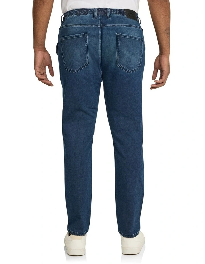 Carl Tapered Knit Denim Jeans in Dark Wash
