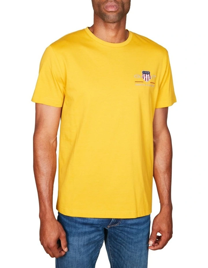 Embroidered Archive Shield T-Shirt in Dark Mustard Yellow