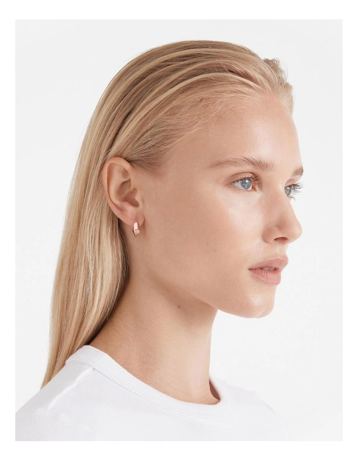 The Edge Huggie Hoop Earrings in Rose Gold