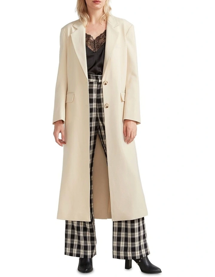 Transcendent Asymmetric Split Hem Coat in Cream