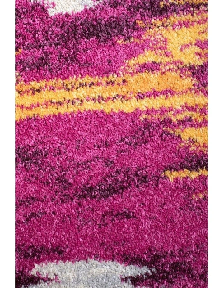 Dimensions Divinity Burst Modern Rug in Aubergine