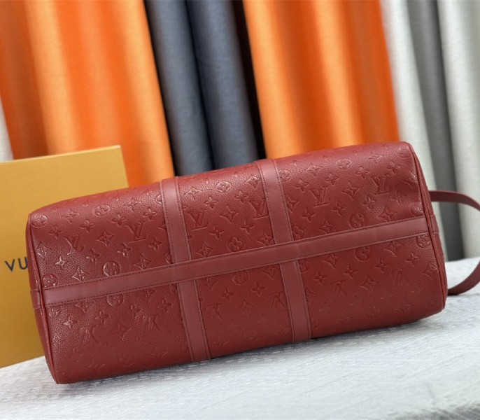 Louis Vuitton Taurillon Leather Keepall Bandouliere 50 In Sari Red