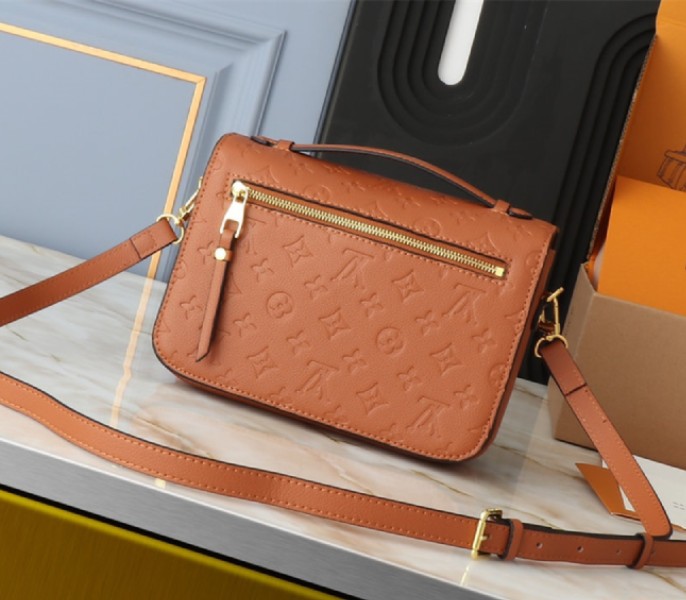 Louis Vuitton Monogram Empreinte Metis Handbag In Cognac Brown