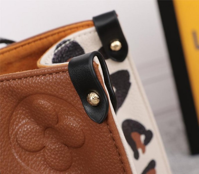 Louis Vuitton Monogram Empreinte Wild At Heart Onthego MM Tote In Caramel Brown