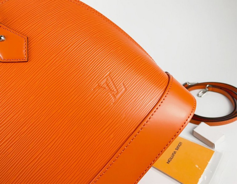 Louis Vuitton Epi Leather Alma PM Handbag In Orange With Jacquard Strap