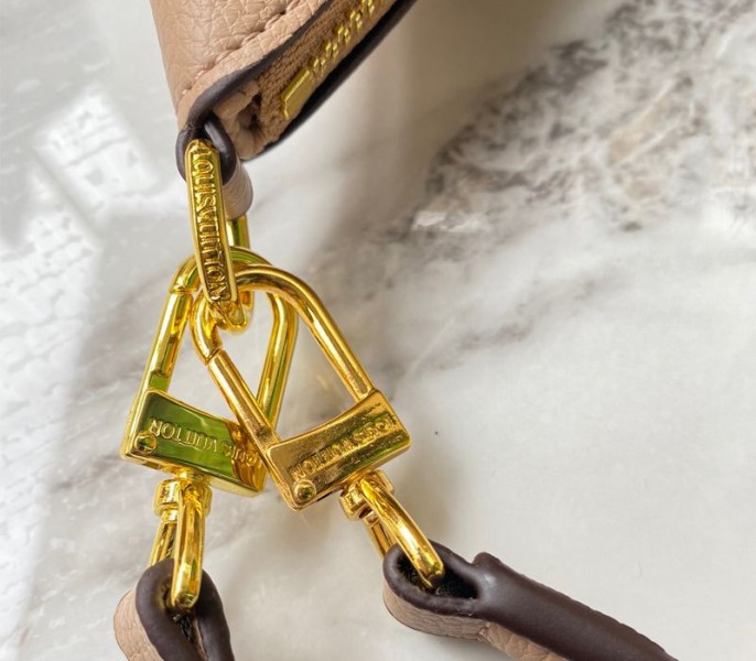 Louis Vuitton Monogram Empreinte Leather Bagatelle Mini Hobo In Beige