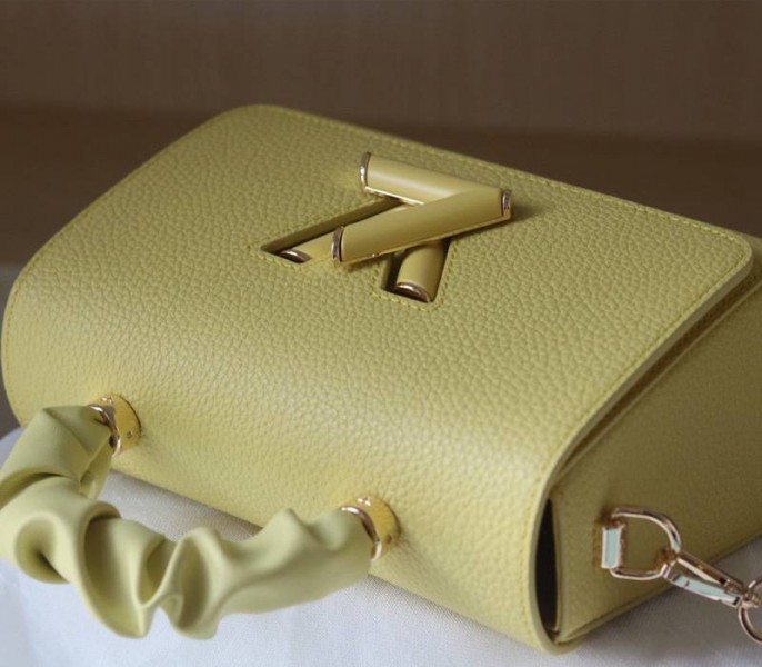 Louis Vuitton Taurillon Leather Twist MM Scrunchie Handle In Ginger Yellow