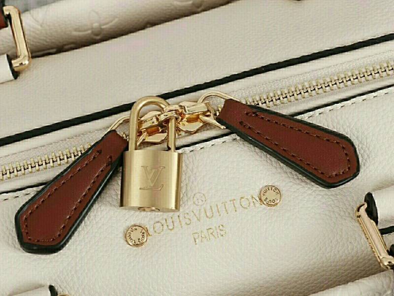 Louis Vuitton Monogram Empreinte Speedy Bandouliere 25 Handbag In Cream