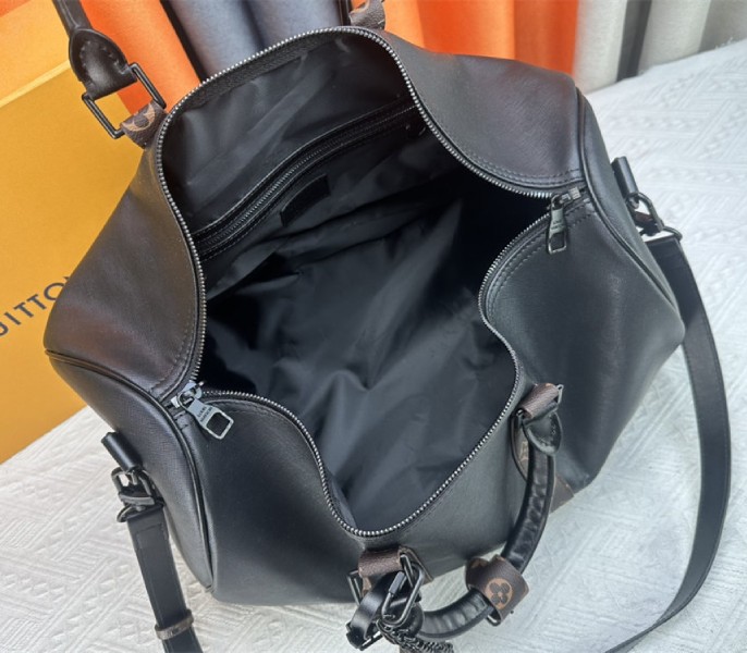 Louis Vuitton Taiga Leather Keepall Bandouliere 45 In Black And Monogram Macassar Canvas