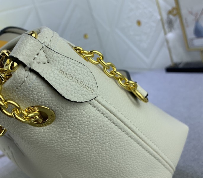 Louis Vuitton Monogram Empreinte Leather Bundle Bag In Cream