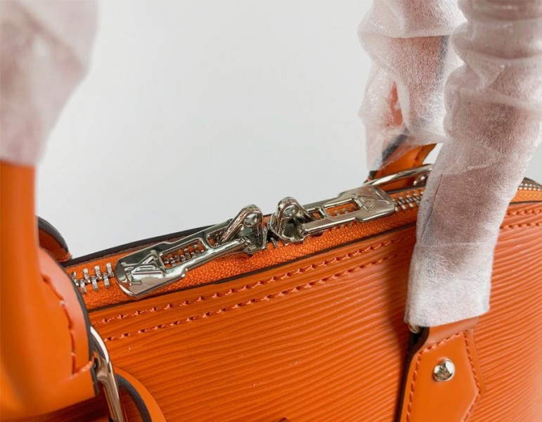 Louis Vuitton Epi Leather Alma PM Handbag In Orange With Jacquard Strap