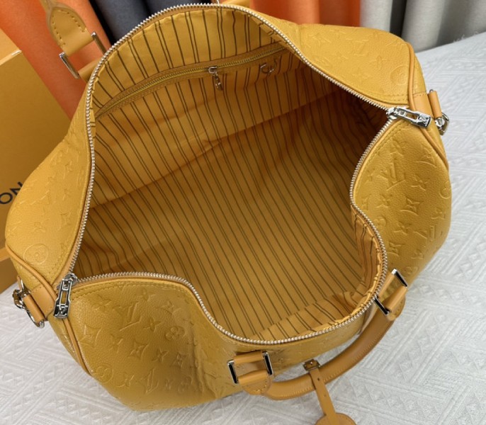 Louis Vuitton Taurillon Leather Keepall Bandouliere 50 In Safran Yellow