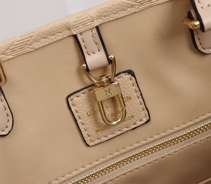 Louis Vuitton Monogram Empreinte Giant Onthego MM Bag In Beige