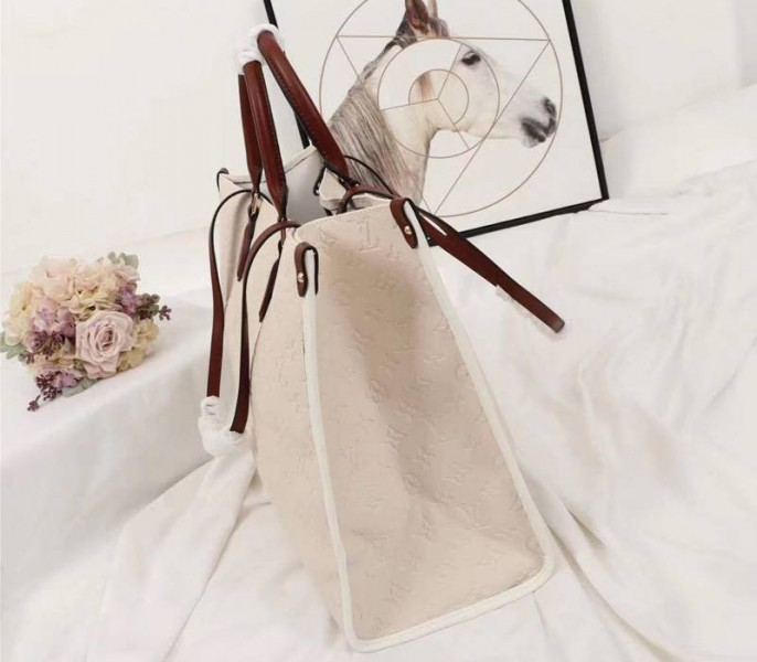 Louis Vuitton Monogram Empreinte Onthego GM Tote In Cream