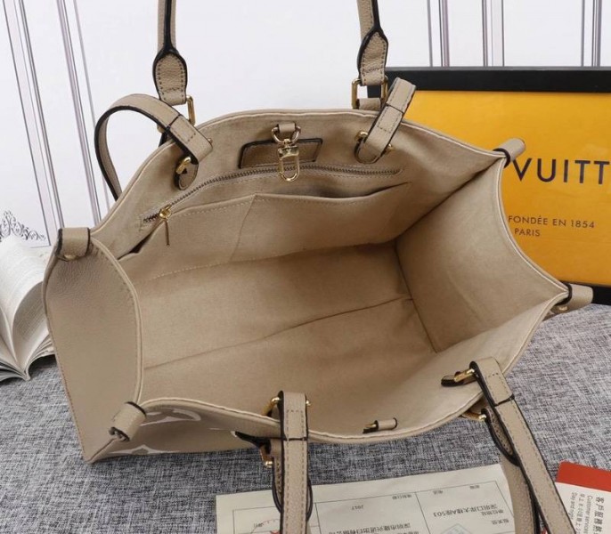 Louis Vuitton Monogram Empreinte OnTheGo MM Tote In Tourterelle Gray