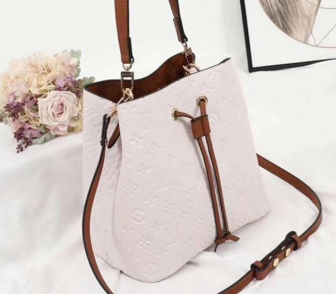 Louis Vuitton Monogram Empreinte NeoNoe MM Bag In Cream