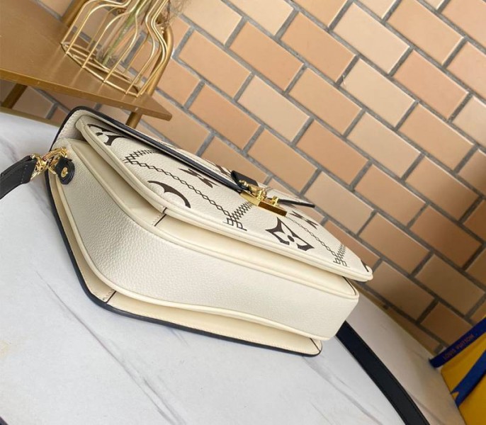 Louis Vuitton Spring 2022 Monogram Empreinte Pochette Metis Handbag In Cream