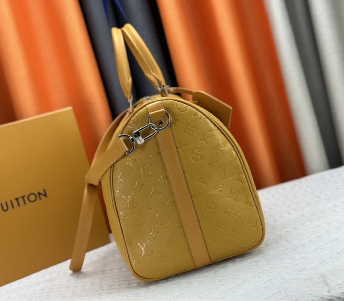 Louis Vuitton Taurillon Leather Keepall Bandouliere 50 In Safran Yellow