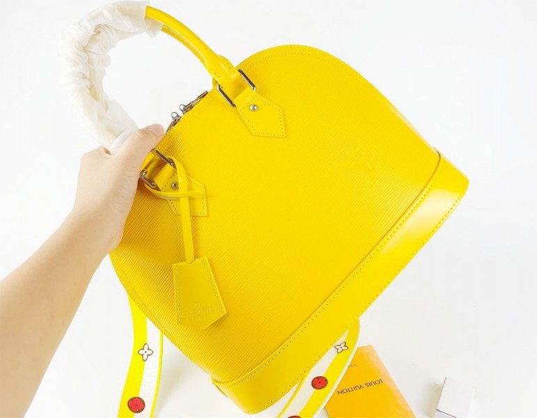 Louis Vuitton Epi Leather Alma PM Handbag In Cedrat Yellow With Jacquard Strap
