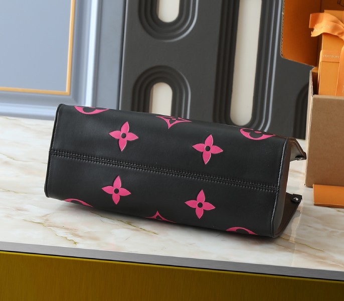 Monogram Empreinte OnTheGo MM Tote In Black And Magenta Pink