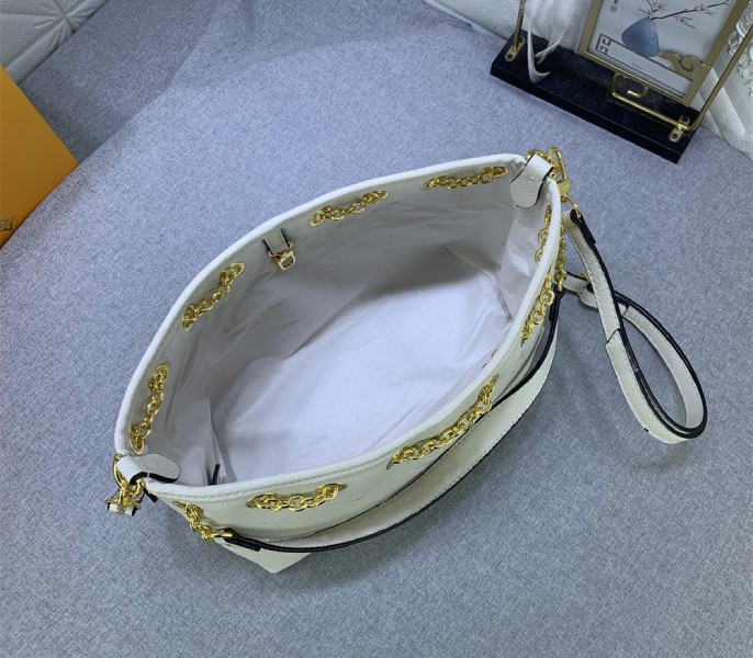 Louis Vuitton Monogram Empreinte Leather Bundle Bag In Cream