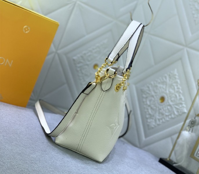 Louis Vuitton Monogram Empreinte Leather Bundle Bag In Cream