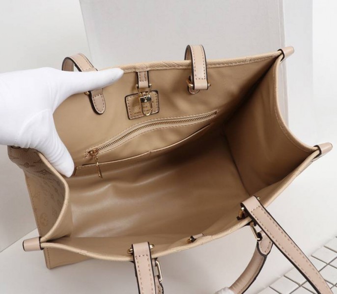 Louis Vuitton Monogram Empreinte Giant Onthego MM Bag In Beige