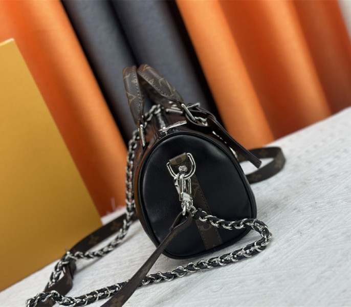 Louis Vuitton Vibe Keepall Bandouliere 25 In Black And Monogram Canvas