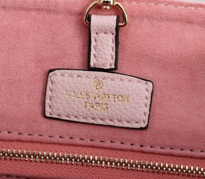 Louis Vuitton Monogram Empreinte Leather Onthego MM Bag In Pink