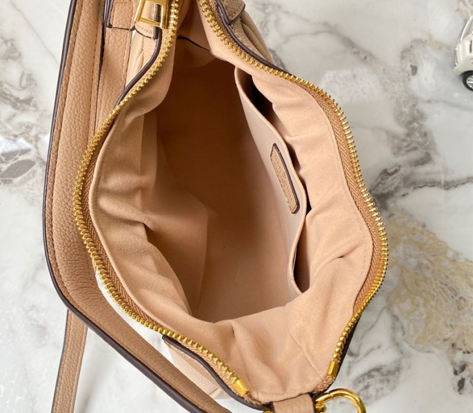 Louis Vuitton Monogram Empreinte Leather Bagatelle Mini Hobo In Beige