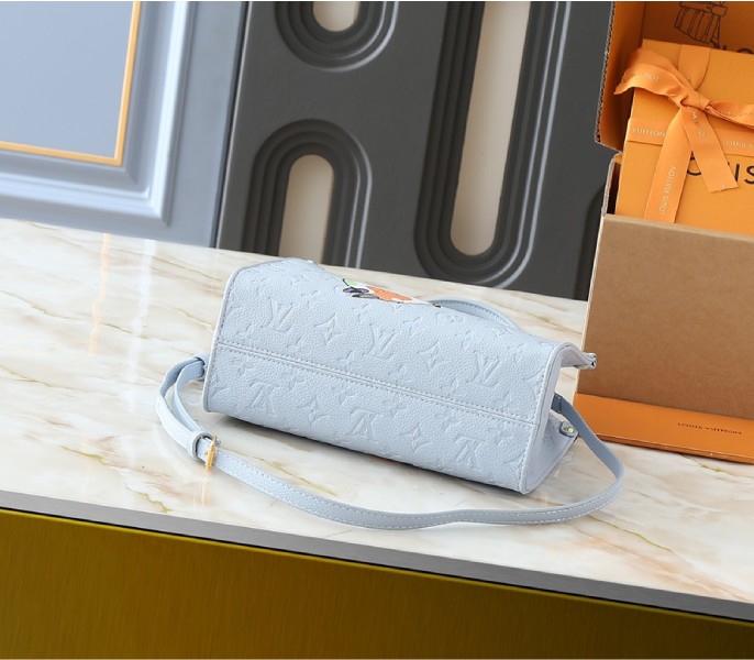 X TM Monogram Empreinte OnTheGo PM With Bijou Edition In Washed Blue