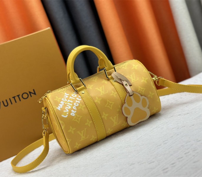 Louis Vuitton Monogram Heritage Canvas Keepall Bandouliere 25 In Yellow