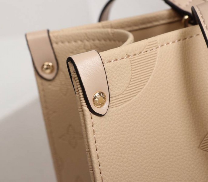 Louis Vuitton Monogram Empreinte Giant Onthego MM Bag In Beige