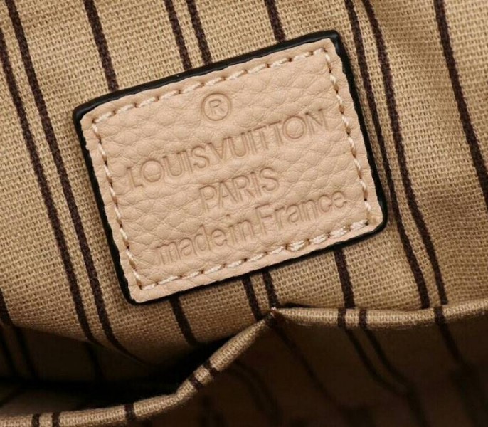 Louis Vuitton Monogram Empreinte Melie Hobo In Beige