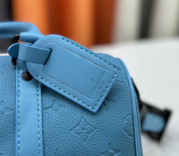 Louis Vuitton Taurillon Monogram Leather Keepall Bandouliere 25 In Turquoise