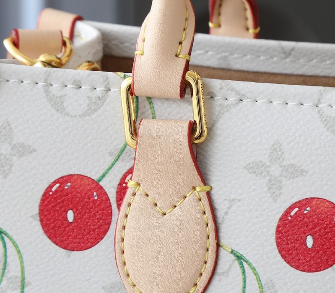 X TM Monogram Cherry Canvas Onthego PM In White