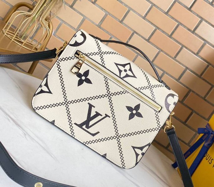 Louis Vuitton Spring 2022 Monogram Empreinte Pochette Metis Handbag In Cream