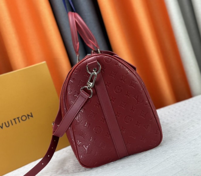 Louis Vuitton Taurillon Leather Keepall Bandouliere 50 In Sari Red