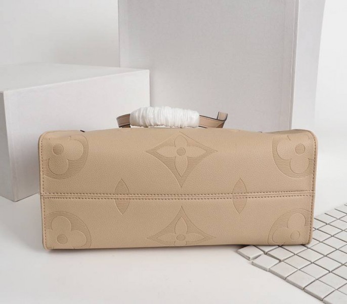 Louis Vuitton Monogram Empreinte Giant Onthego MM Bag In Beige