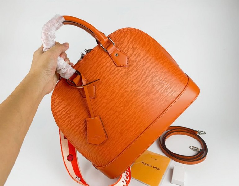 Louis Vuitton Epi Leather Alma PM Handbag In Orange With Jacquard Strap