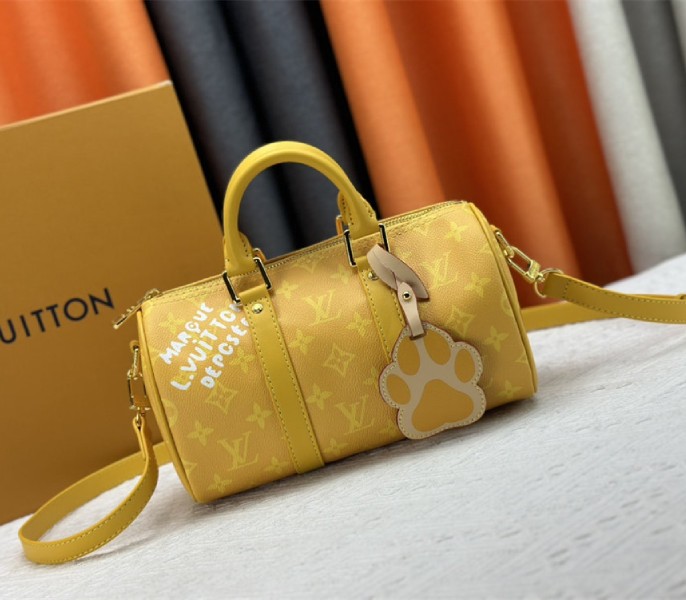 Louis Vuitton Monogram Heritage Canvas Keepall Bandouliere 25 In Yellow