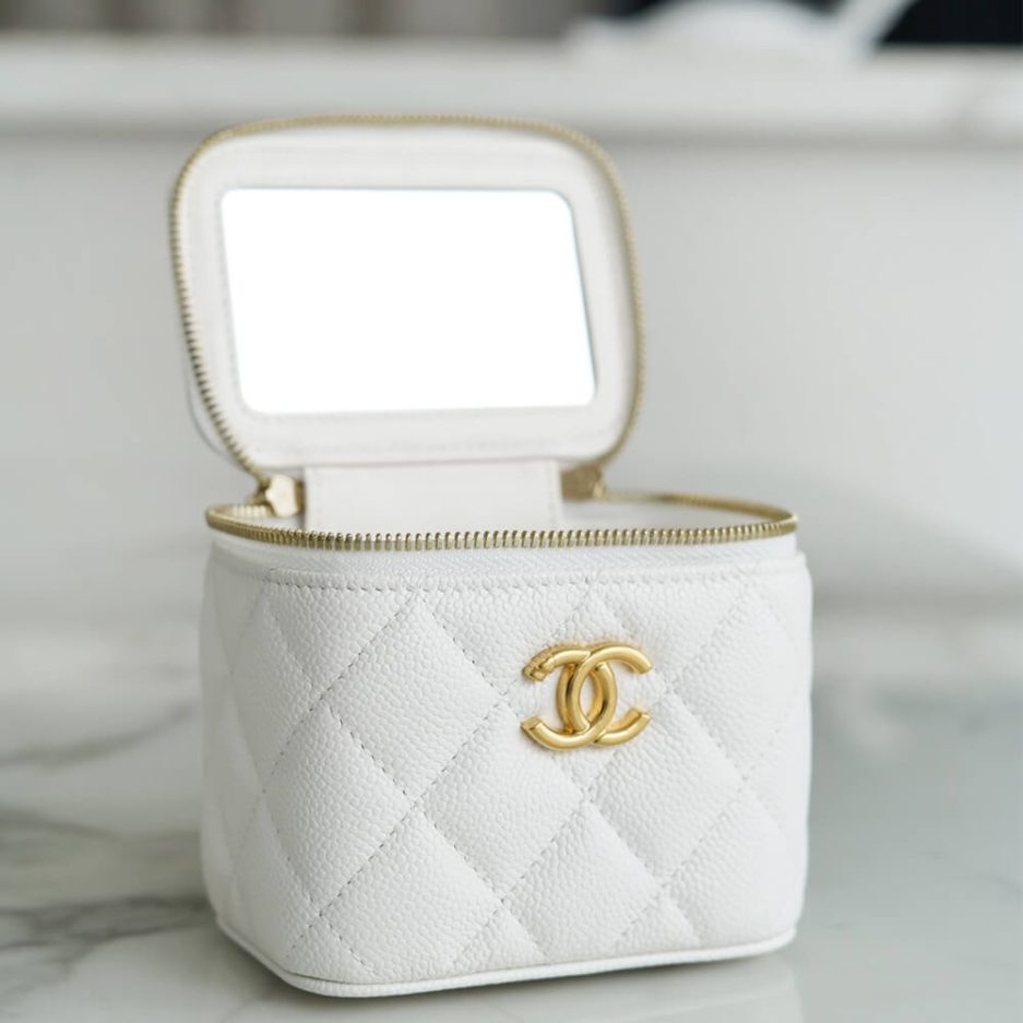 Chanel small gold ball makeup bag