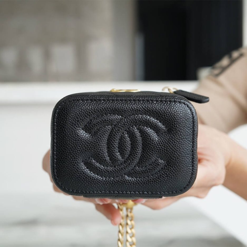 Chanel small gold ball makeup bag