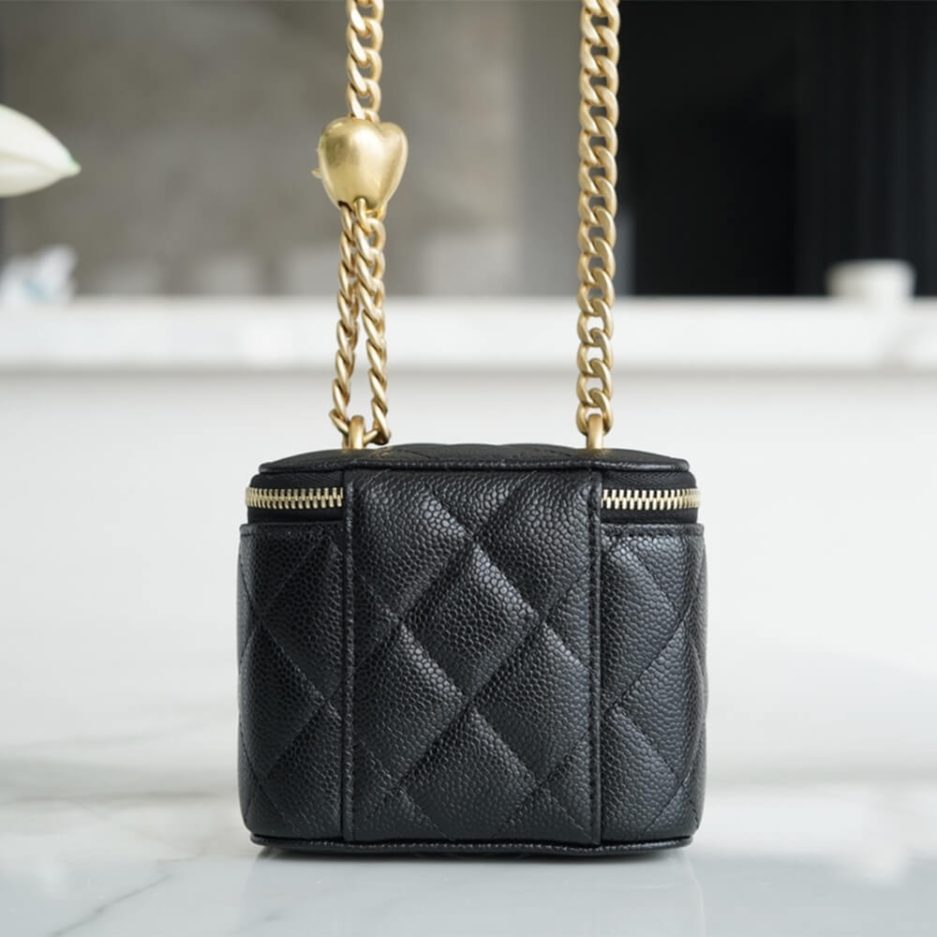 Chanel small gold ball makeup bag