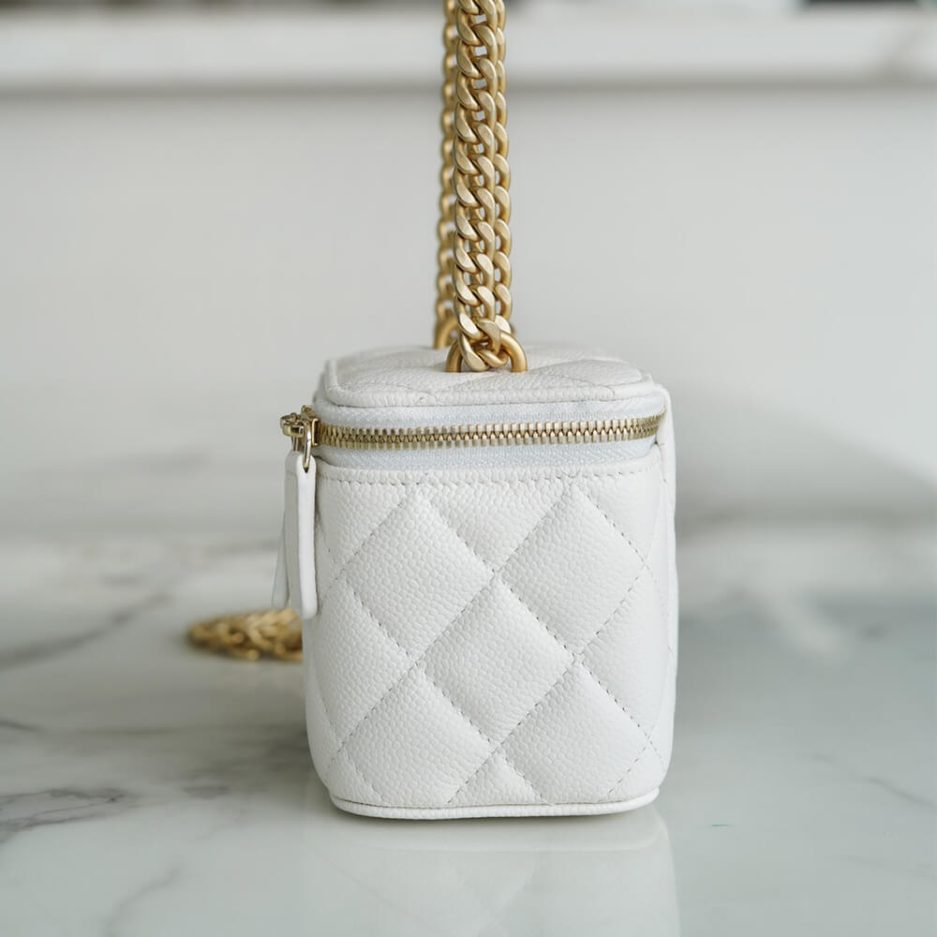 Chanel small gold ball makeup bag
